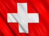 Flag of switzerland waving with highly detailed textile texture pattern